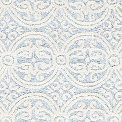 Safavieh Cambridge Collection CAM123A Handmade Moroccan Wool Area Rug, 10' x 14', Light Blue/Ivory