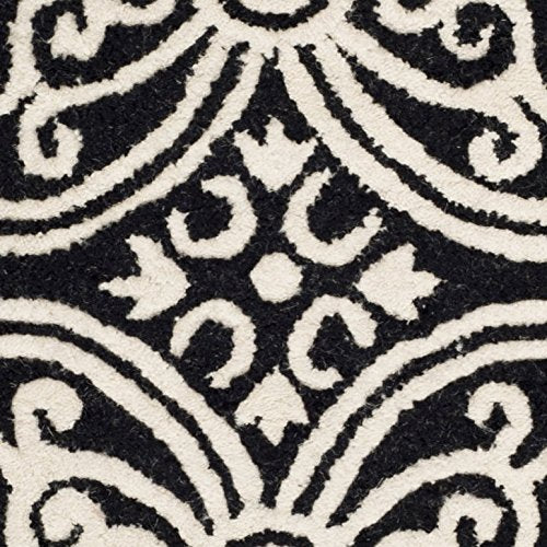 Safavieh Cambridge Collection CAM123E Handmade Moroccan Wool Area Rug, 6' x 9', Black/Ivory