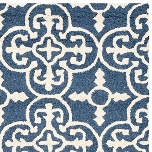 Safavieh Cambridge Collection CAM133G Handmade Moroccan Wool Area Rug, 6' x 9', Navy/Ivory