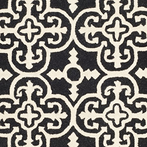 Safavieh Cambridge Collection CAM133E Handmade Moroccan Wool Area Rug, 9' x 12', Black/Ivory